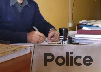 KP Police Man Works in Room